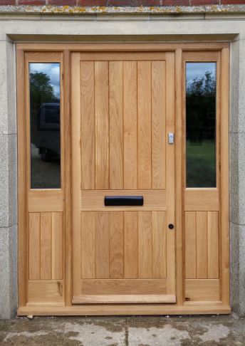 Oak door and frame with side lights.