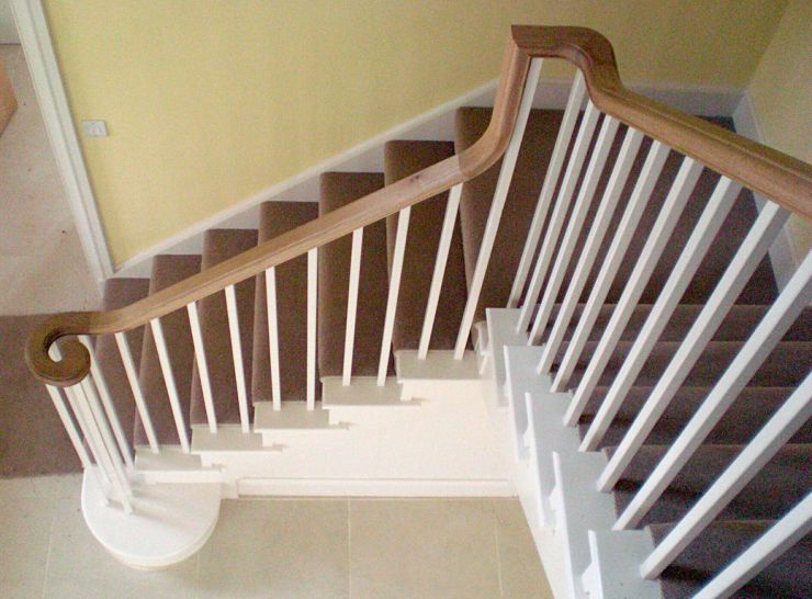Painted staircase with oak continuous handrail