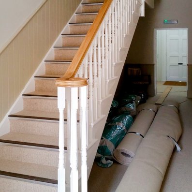 Straight flight with volute oak handrail