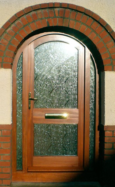 Sapele curved headed door frame with door to suit