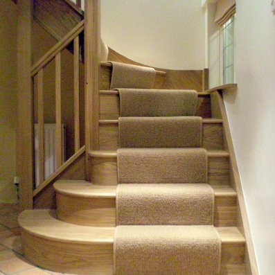 Oak staircase with three bullnose bottom treads to open out into the hallway