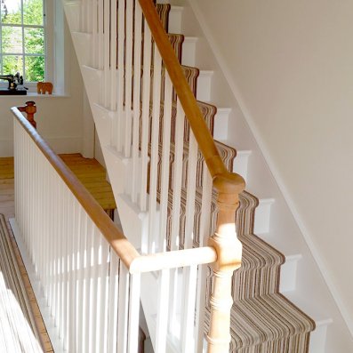 Special turned newel posts on a loft staircase that matches the old existing staircase below