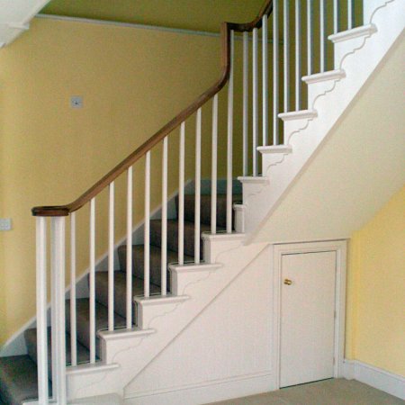 Cut string staircase with oak handrail
