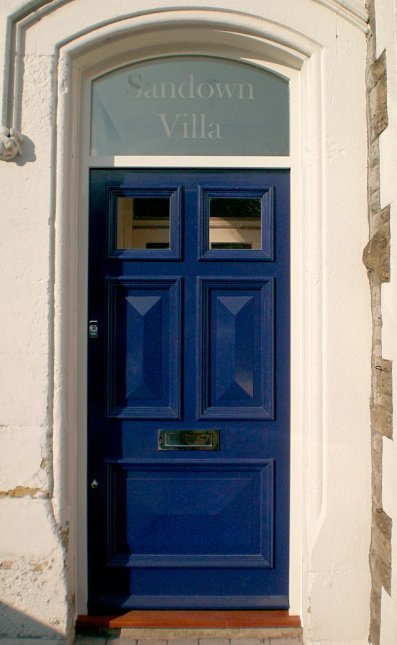 Hardwood panelled door & frame with curved top section