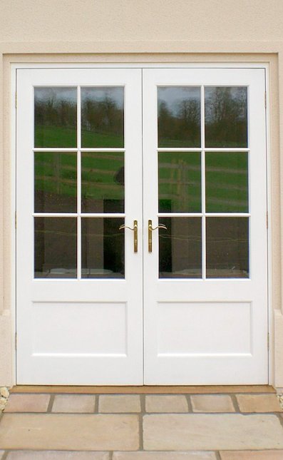 Pair of painted hardwood doors and frame