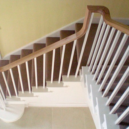 Painted staircase with oak continuous handrail
