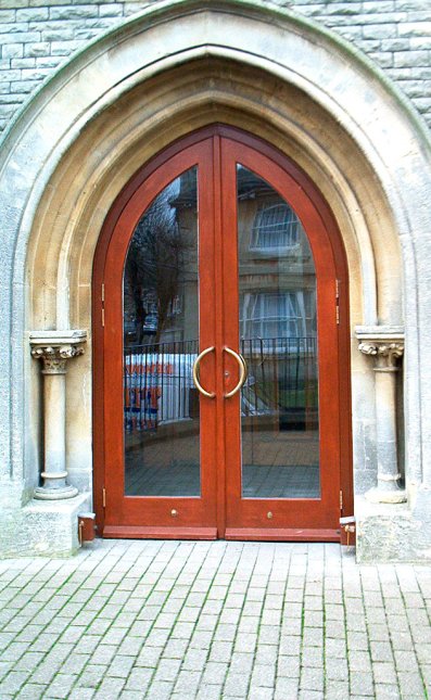 Pair of gothic shaped church doors and frame