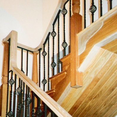 Oak cut string style staircase with metal spindles