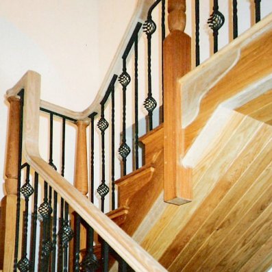 Oak cut string style staircase with metal spindles Oak cut string style staircase with metal spindles