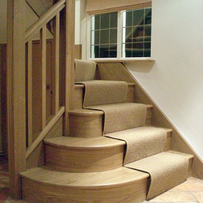 Oak staircase with three bullnose bottom treads to open out into the hallway Oak staircase with three bullnose bottom treads to open out into the hallway