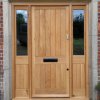 Oak door and frame with side lights.